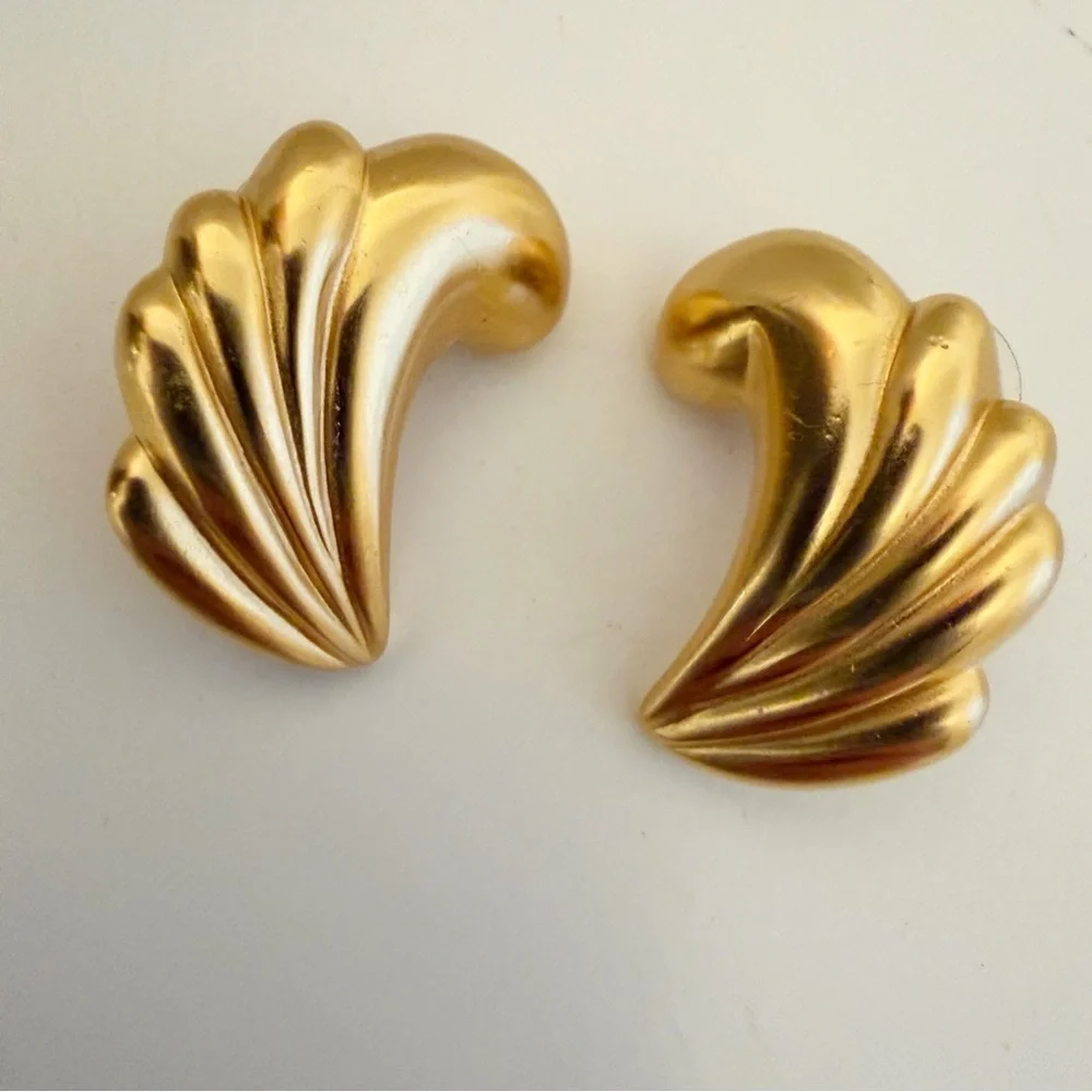Vintage gold-plated, fluted, or ribbed wave design earrings.